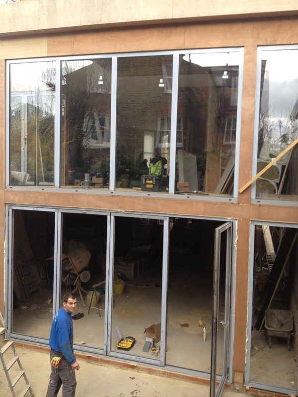 Aluminium bi-fold doors with two-storey glazing in Didcot