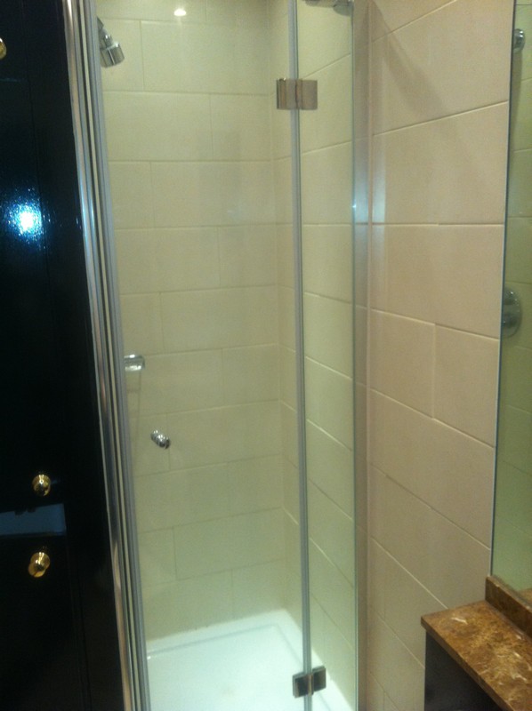Frameless glass shower enclosure with chrome fittings in Didcot