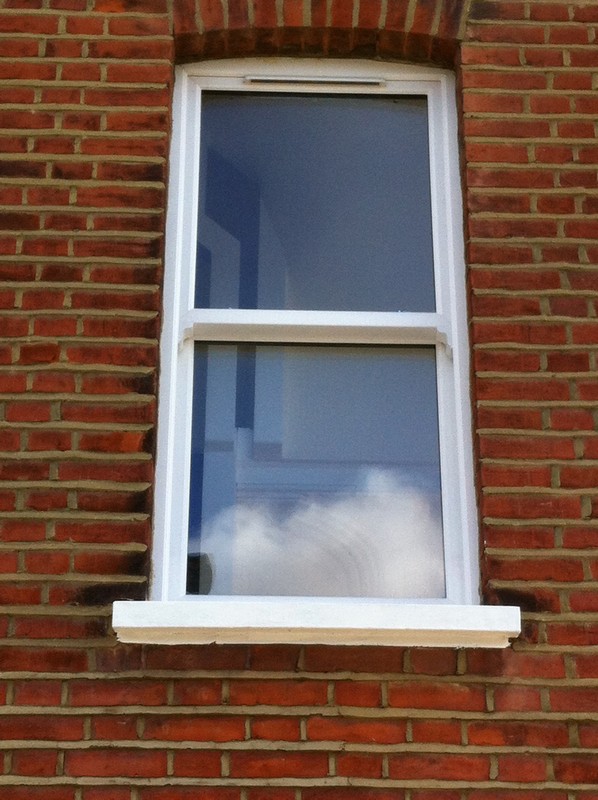 uPVC sash window on Victorian red brick house in Didcot
